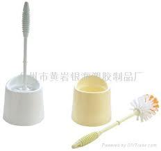 Toilet brush and bowl.