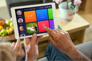 Person using oscar senior application on tablet 